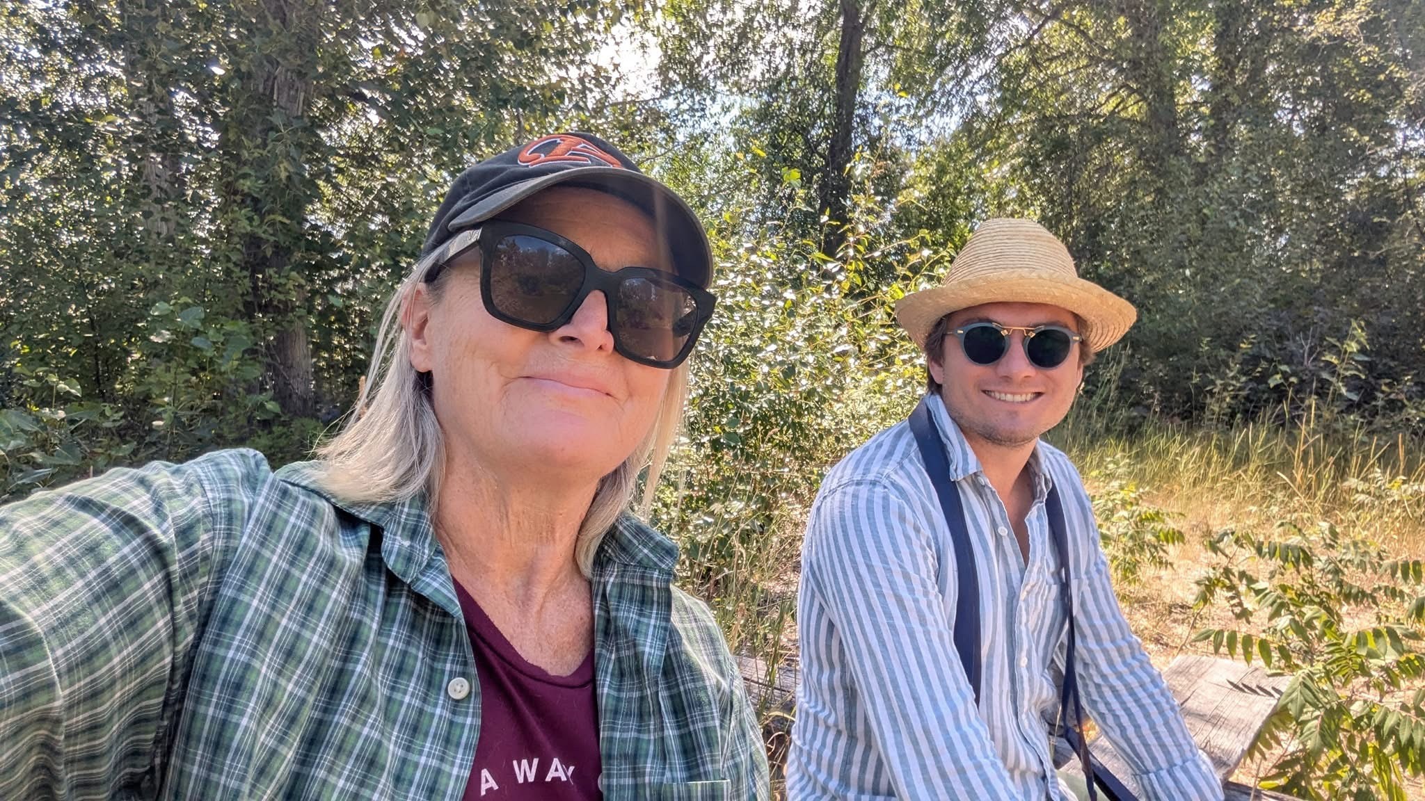 man filming on beach