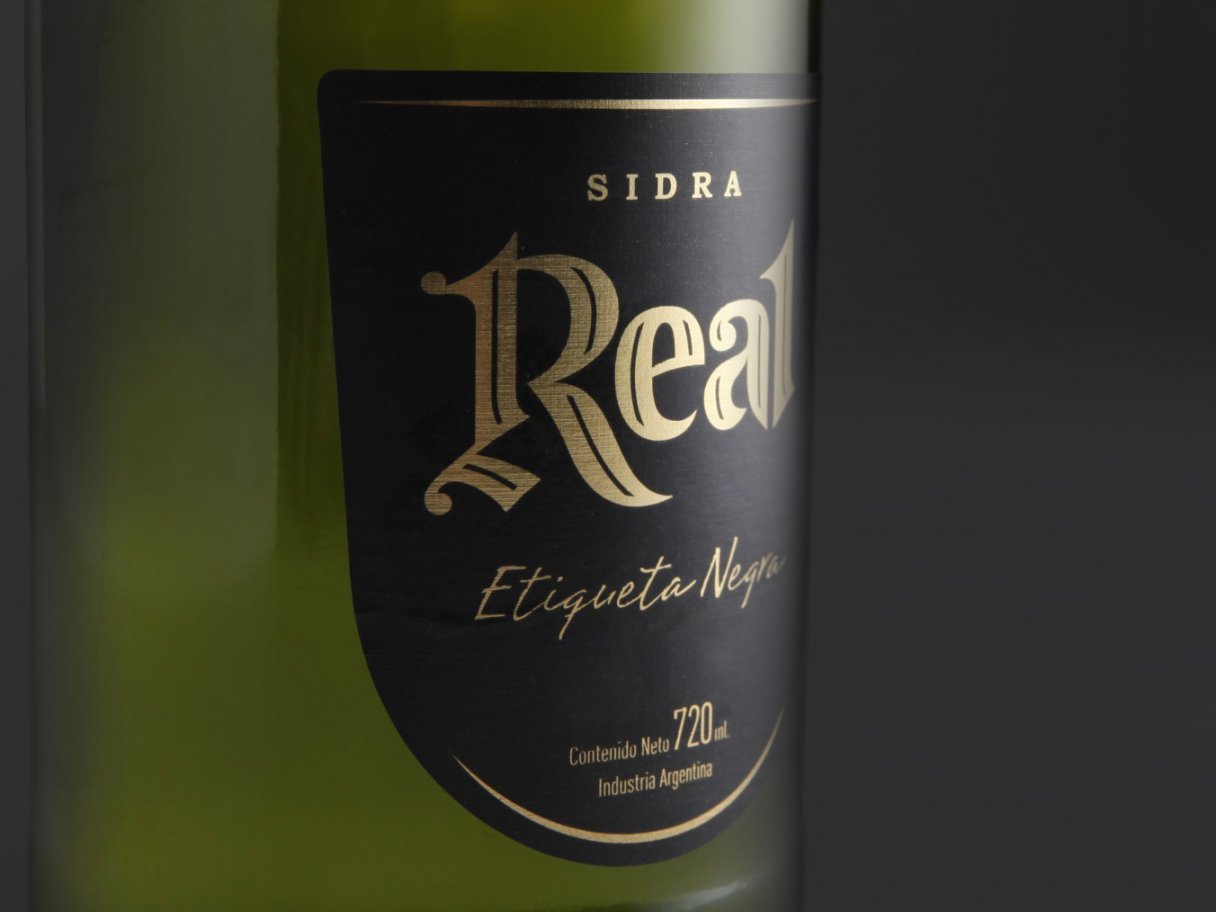 Rustic cabin in a golden field at sunset