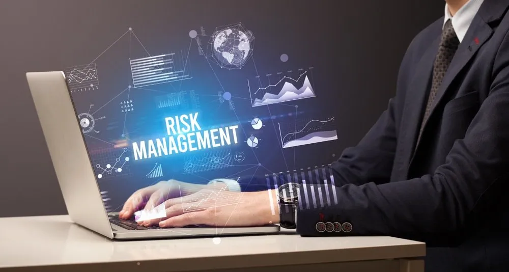 Person Using Laptop - Prop Firm Risk Management