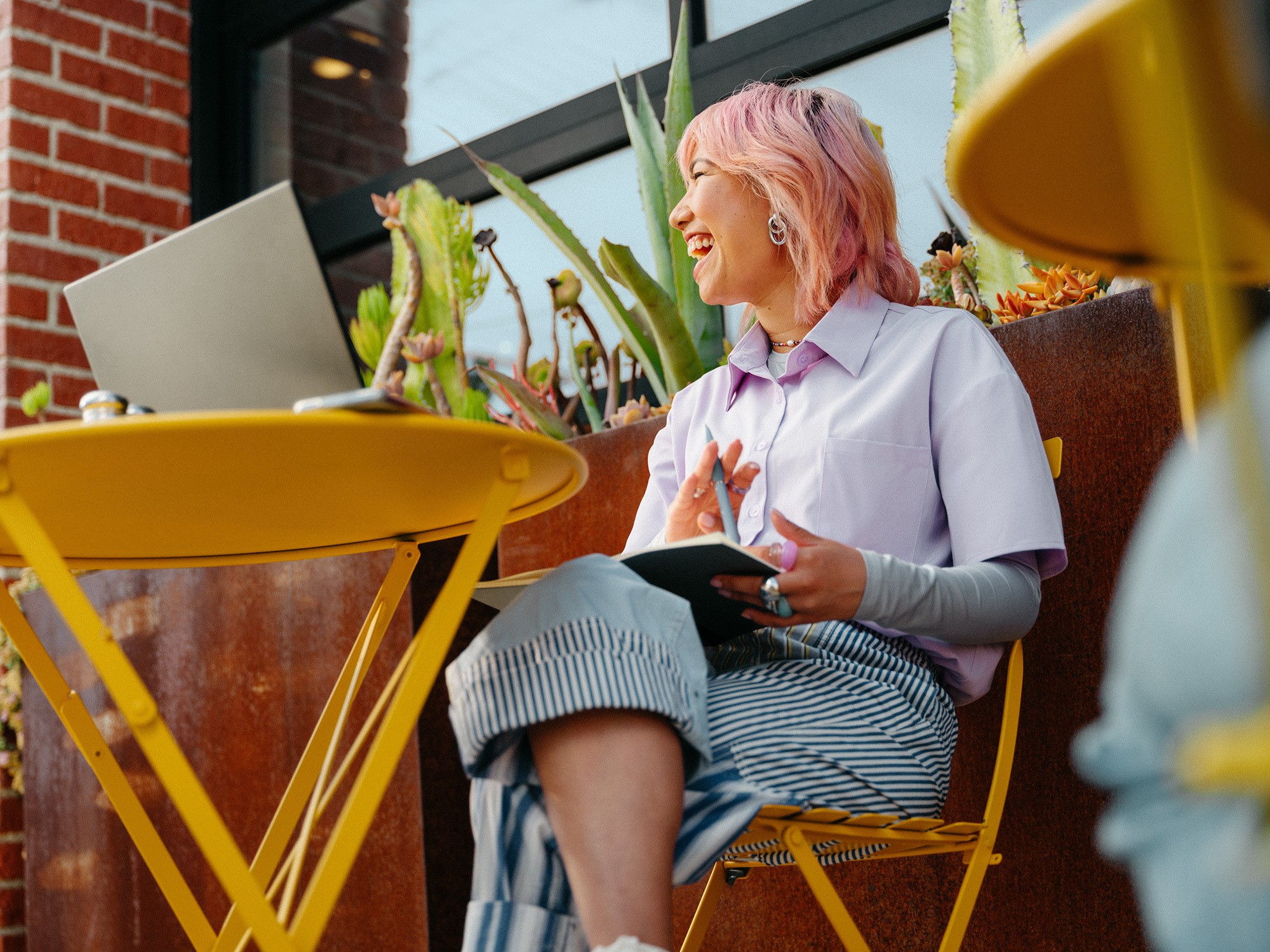happy woman working on laptop and smiling
