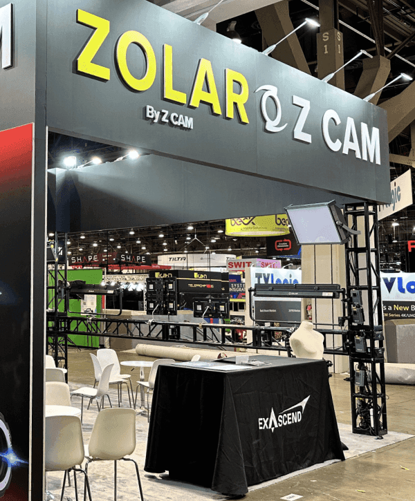 20x30 NAB Show booth overview with broadcast workflow presentation, operator counter, and structured demo screen layout