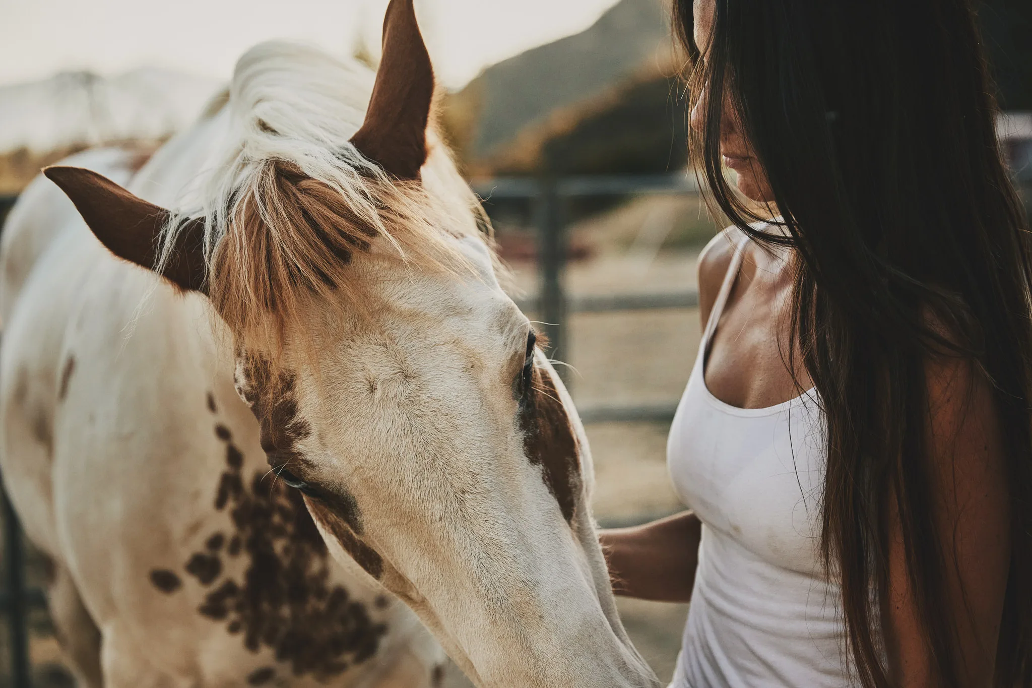 woman face to face with paint horse — Alex Saidac photography by Tom Kubik