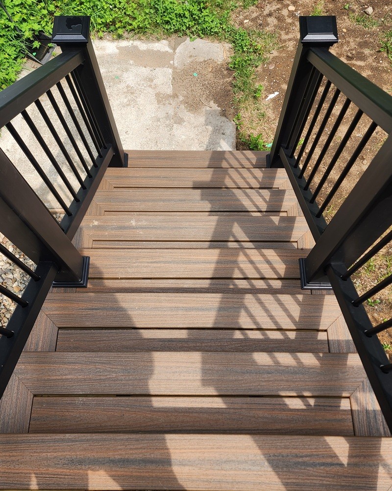 Quality craftsmanship detail of deck stairs picture framing by Jewel Construction