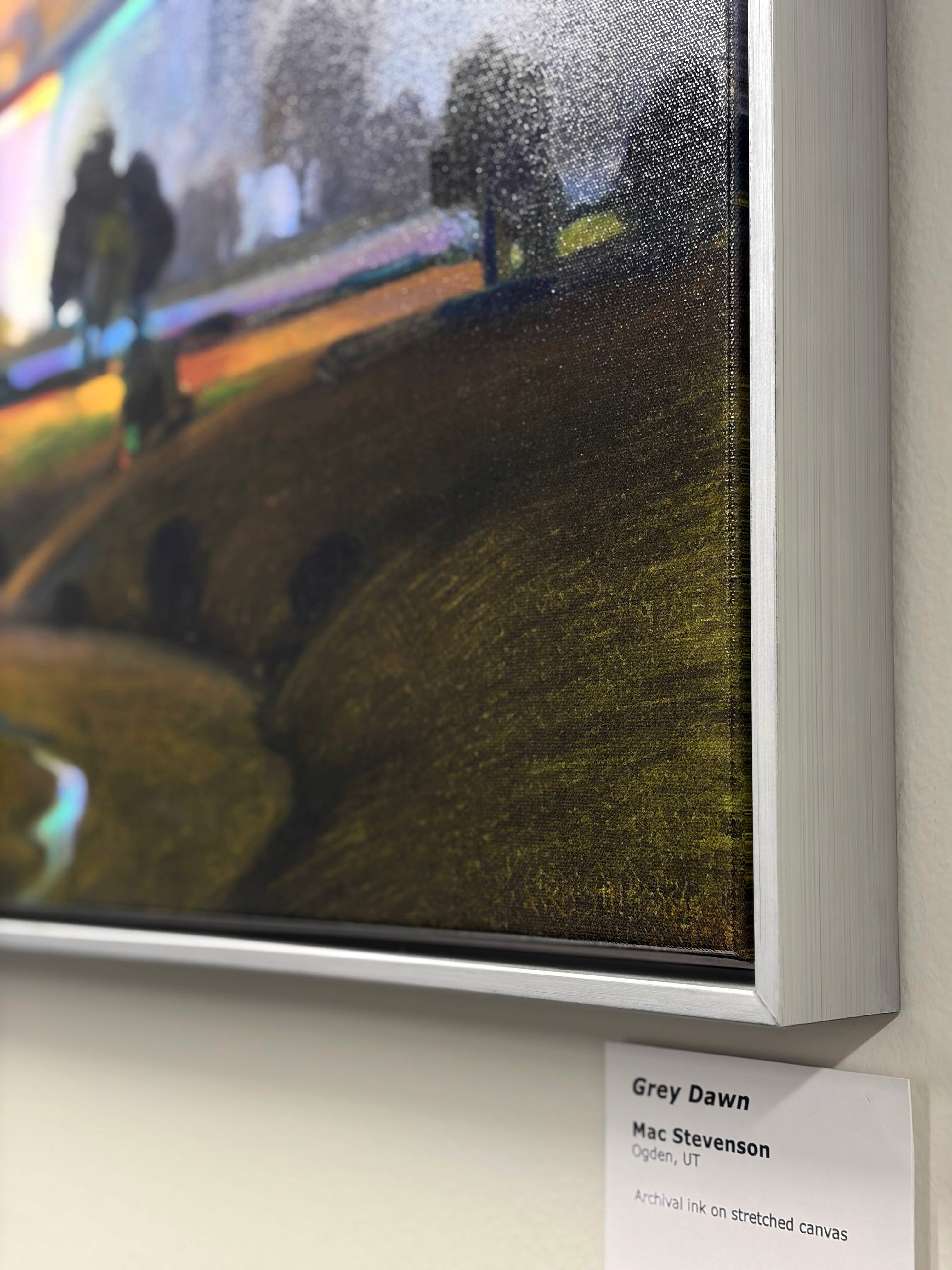 Modern indoor space with large glass doors, lush greenery, and a cozy seating area visible beyond.