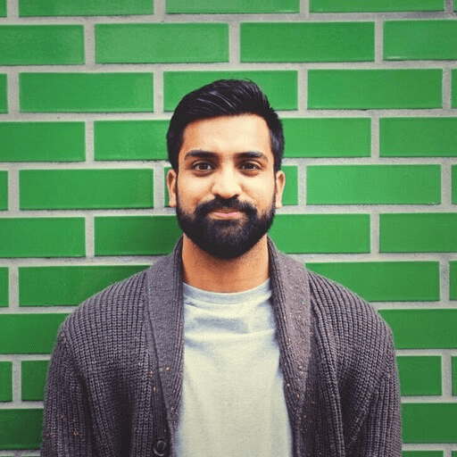Profile portrait of a man in a grey shirt