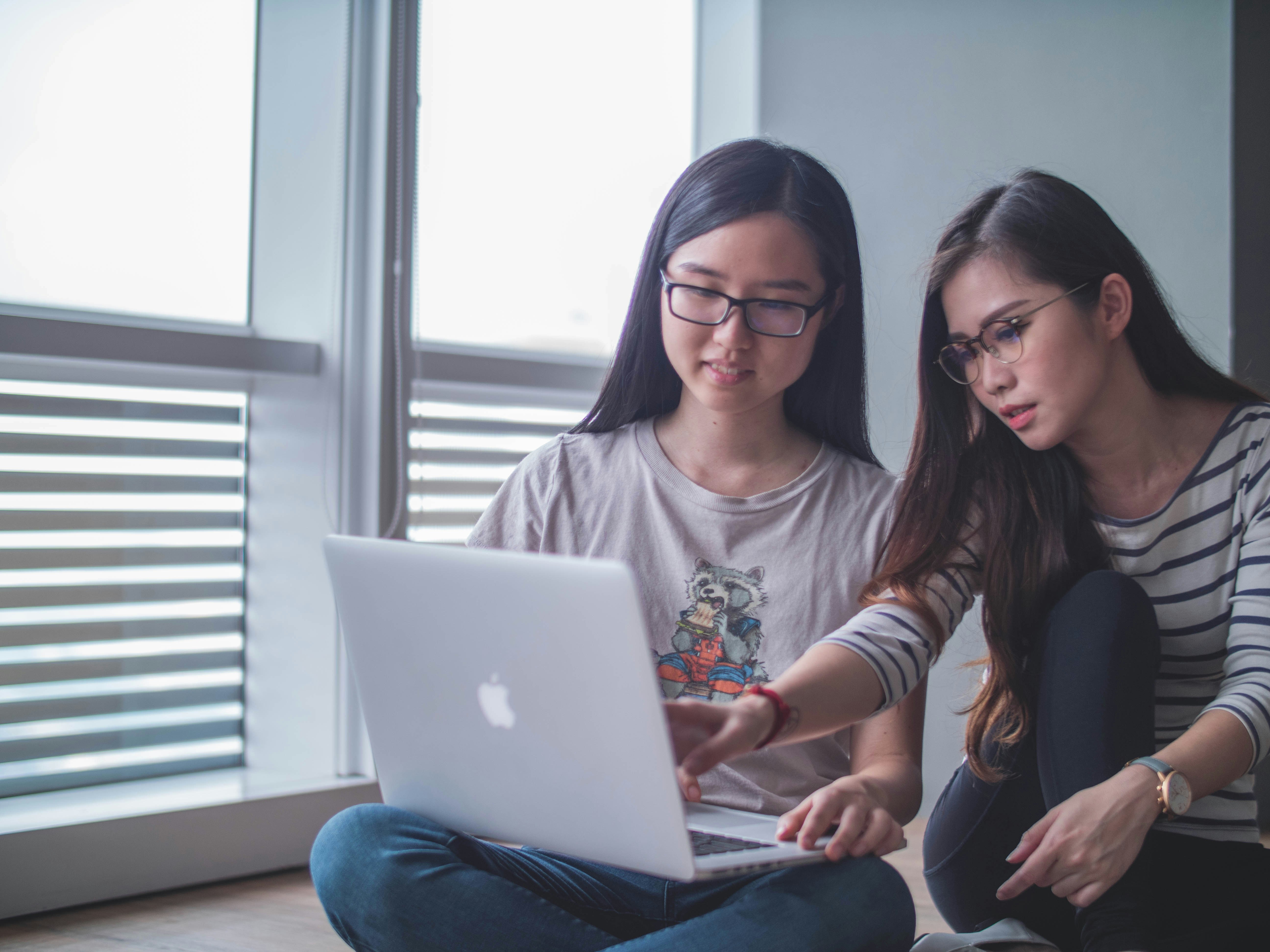 student helping friend to find Research Topics For High School