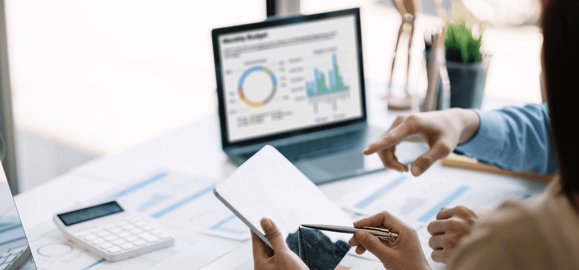 Colleagues reviewing financial data on tablet - Automated Lead Qualification