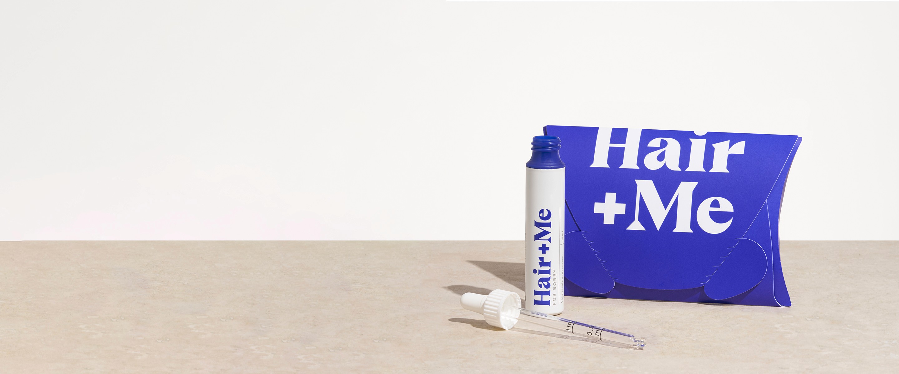 Image with products, The Capsules and The Drops dispayed with a pillow box. There is also a "featured in vogue" badge.