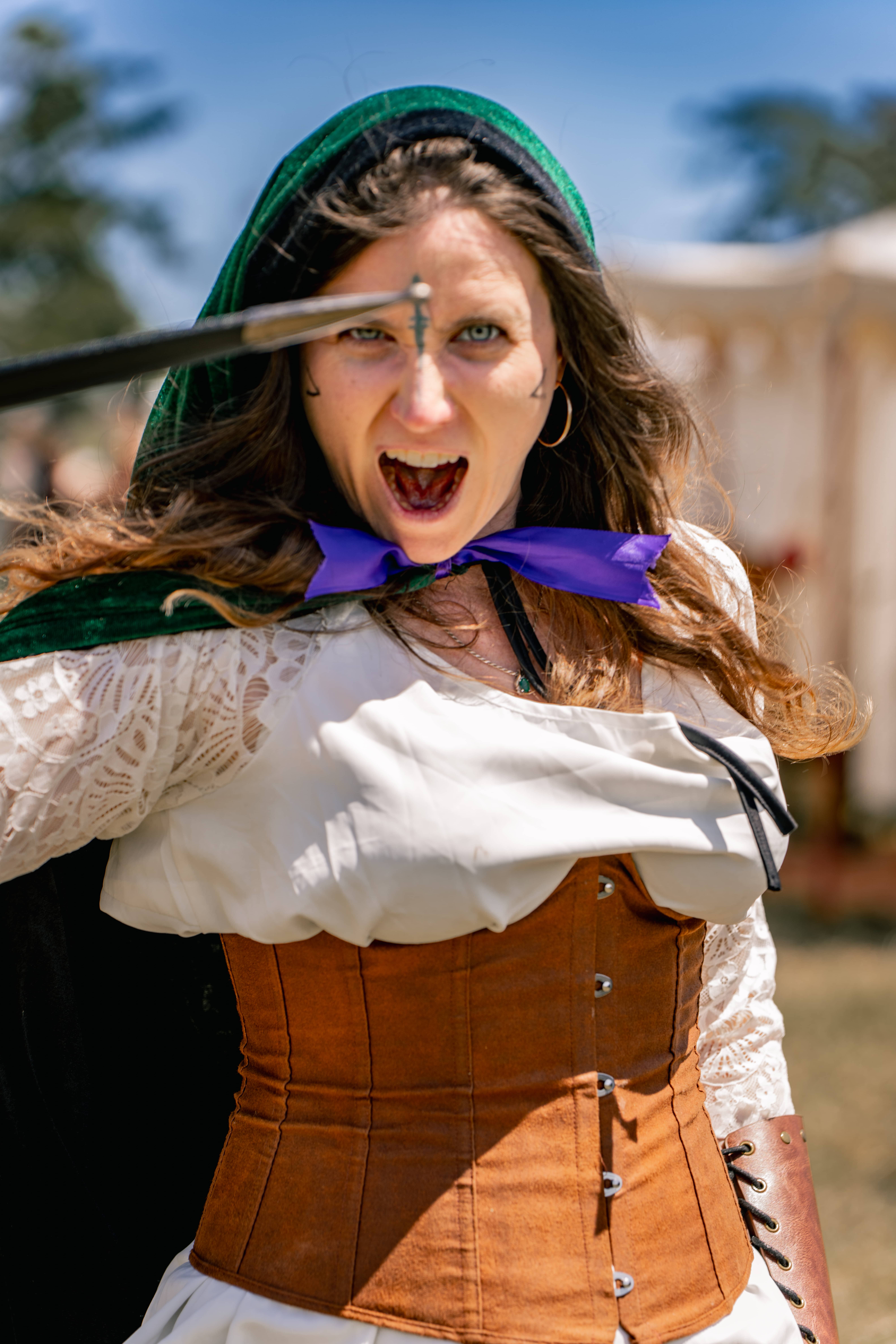 A witch guest showing her wand at wrf