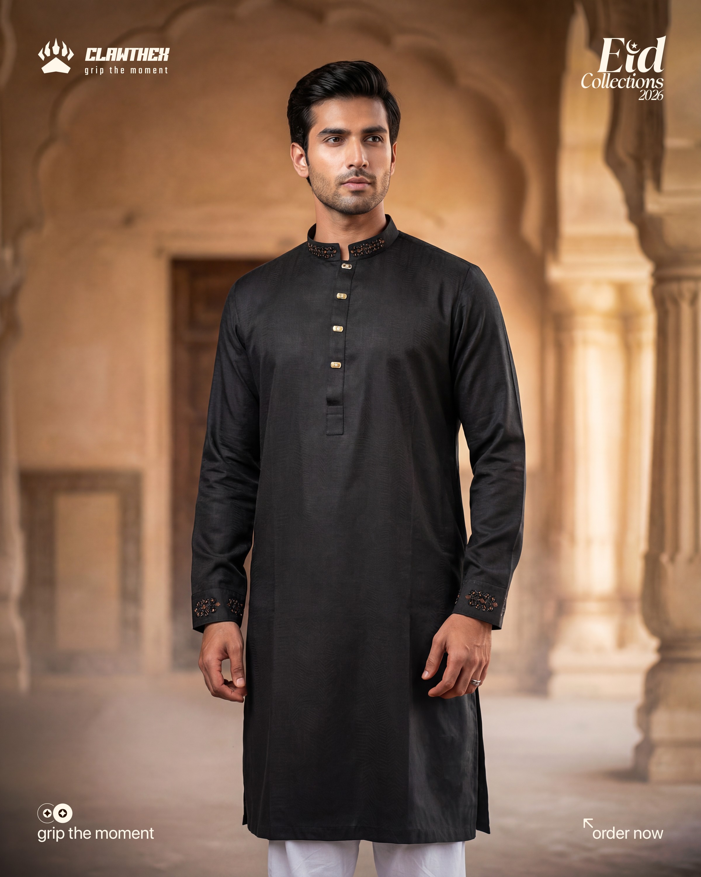 a man with a beard and glasses standing in front of a lamp