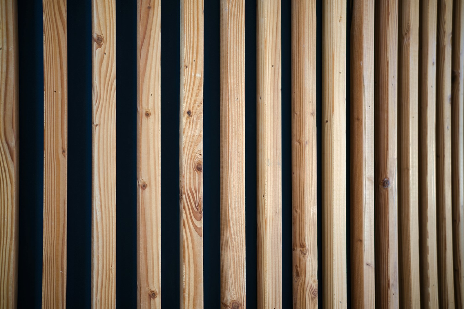 A close up of a wooden slatted wall