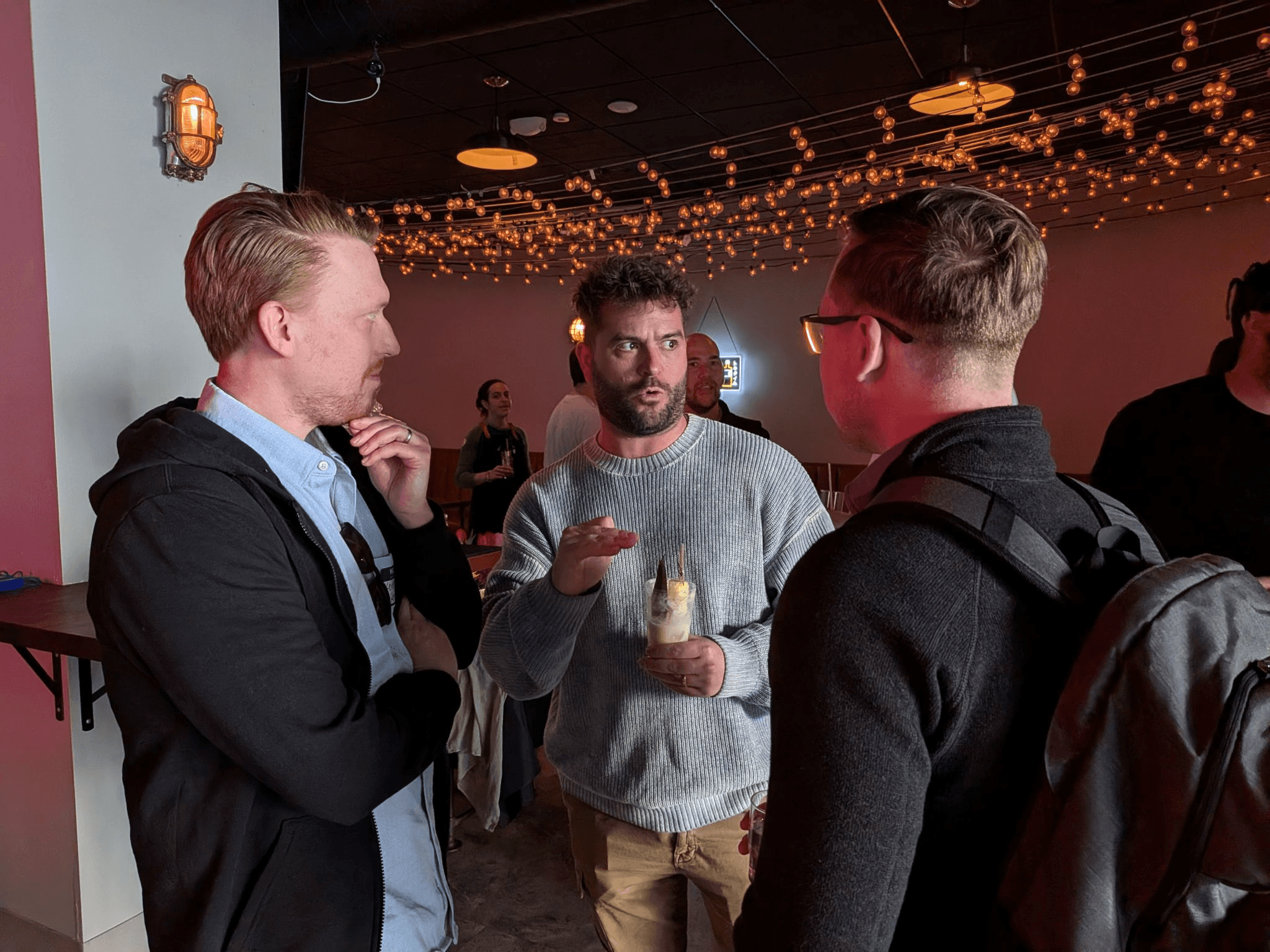 Group of friends posing at a bar
