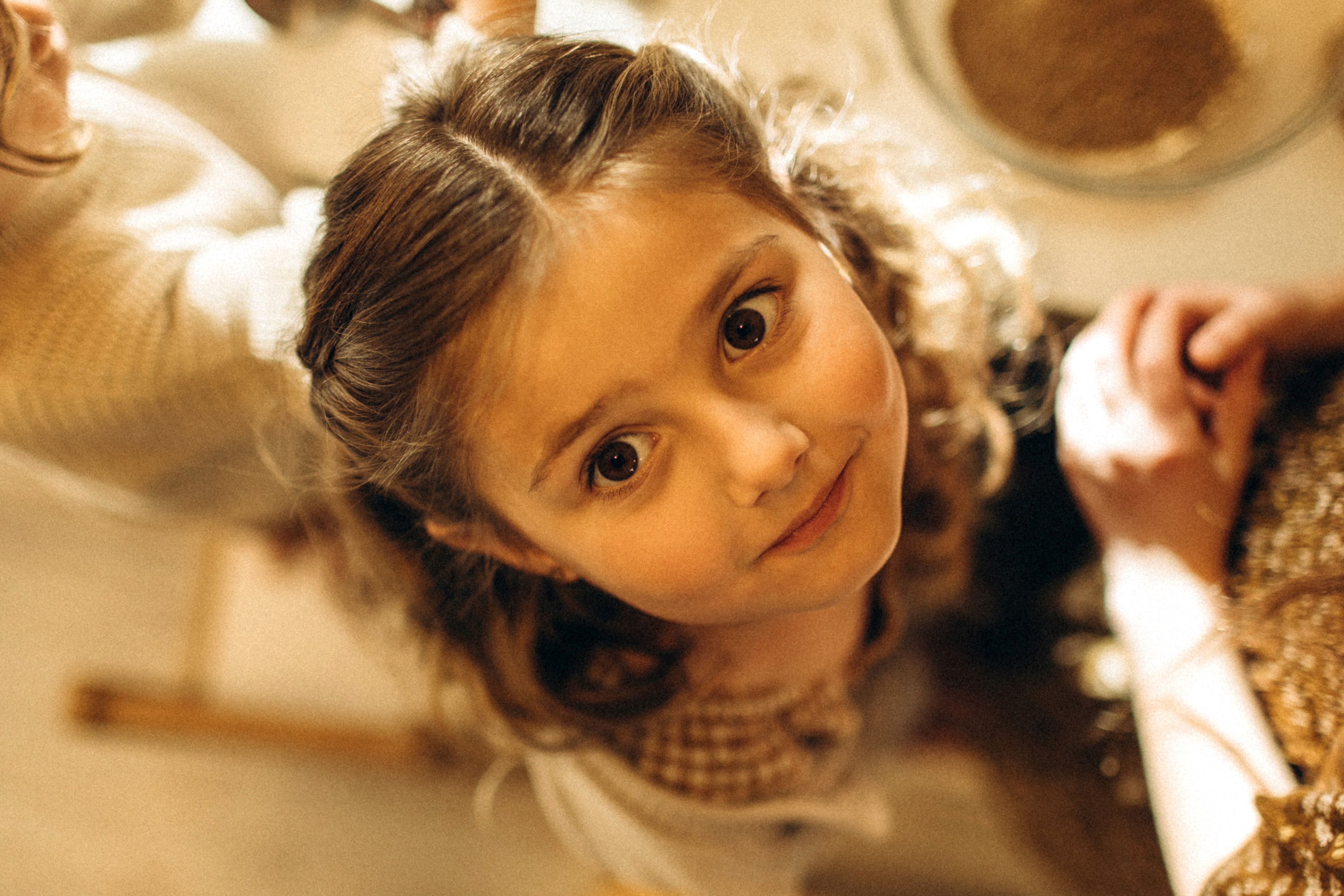 Mother and daughter sharing a tender moment during an in-home family photo session.