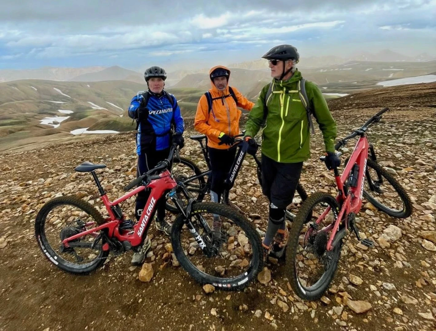 three mountainbikers on a mountain