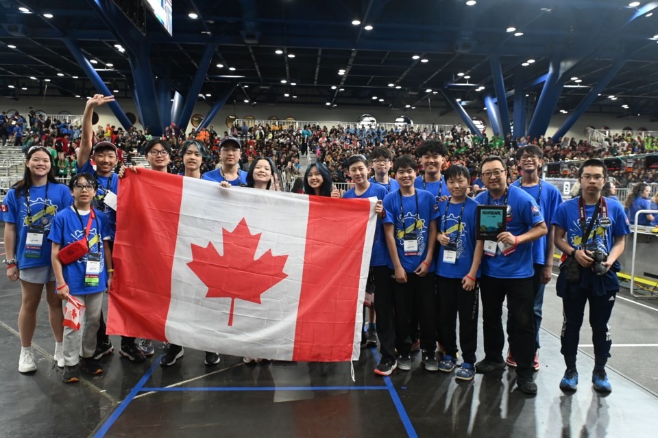 Members of the FRC team, including Ryan Zhang, and Queena Lin, celebrating their rookie team of the year win at the 2025 FIRST Robotics Competition World Championship in Houston in April..jpg