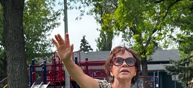 A woman raising her hand in worship