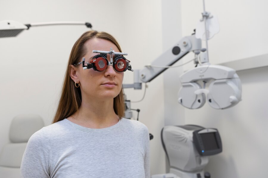 A women getting her eye sight being checked.