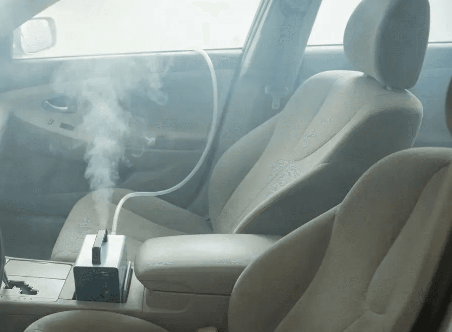 Professional detailing services including advanced molecular odor elimination for car interiors and hand-applied car waxing for exterior paint protection and deep gloss.