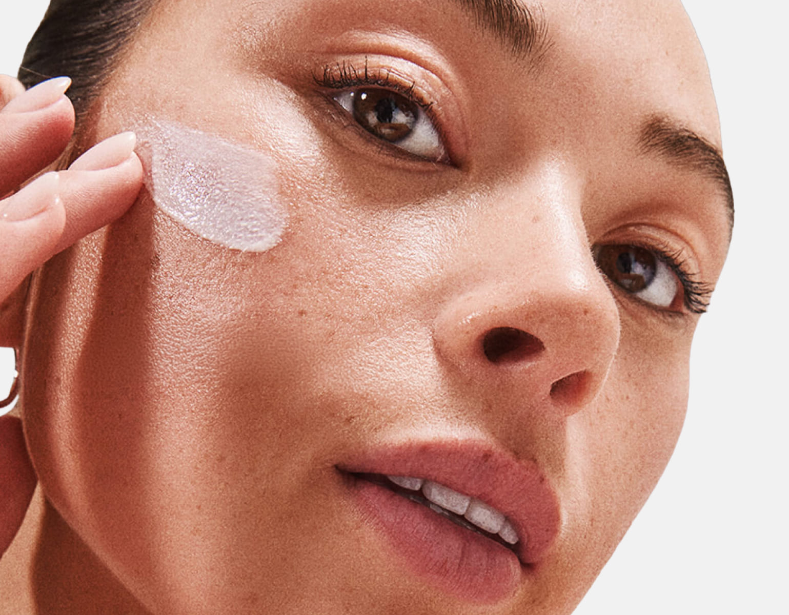 Close-up of clean skincare product application showcasing texture and natural glow