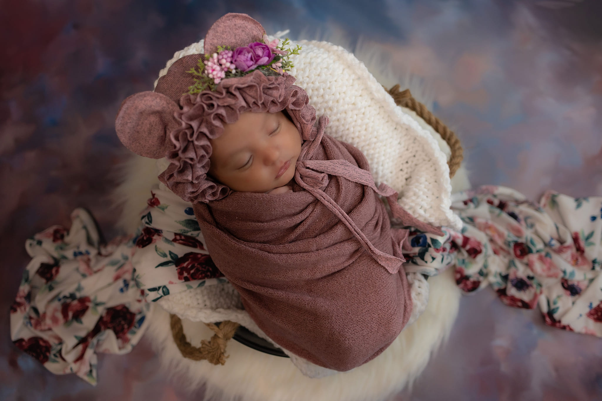 A newborn in a blanket.