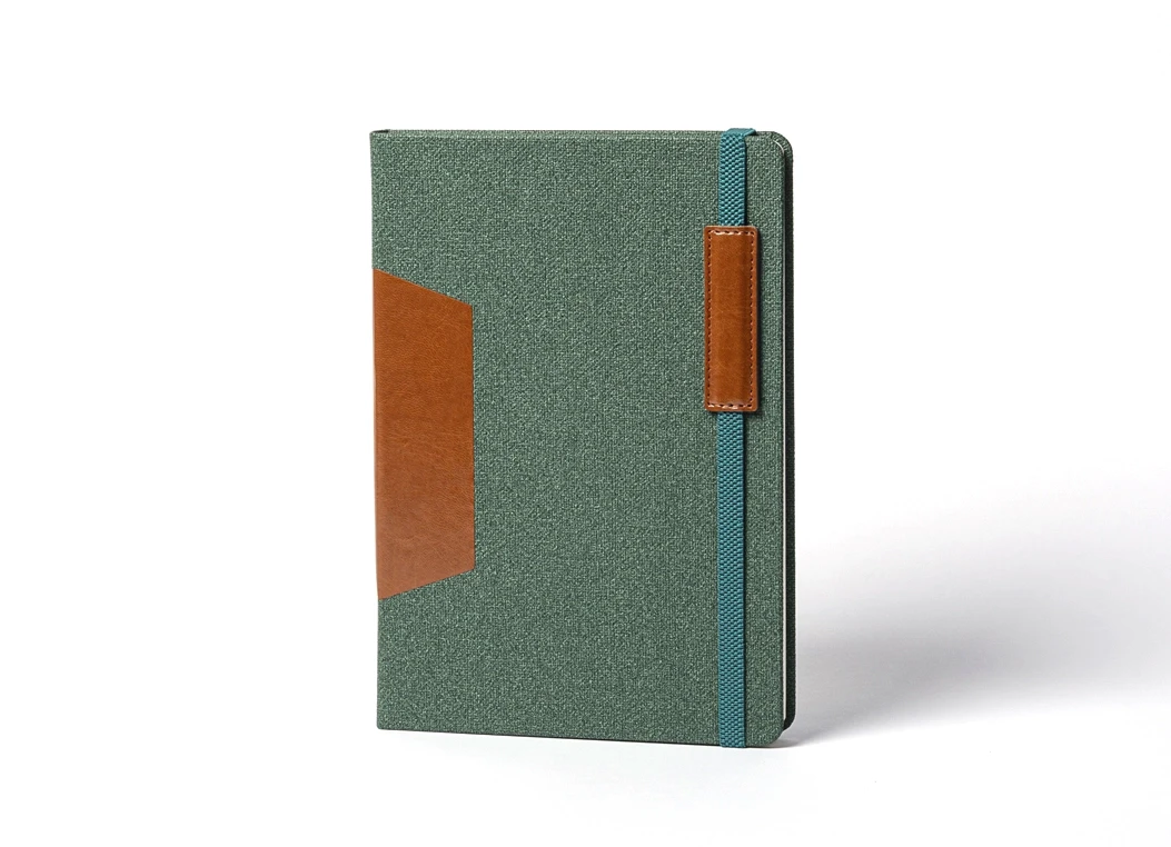 Front view of green fabric notebook with brown leather accents.
