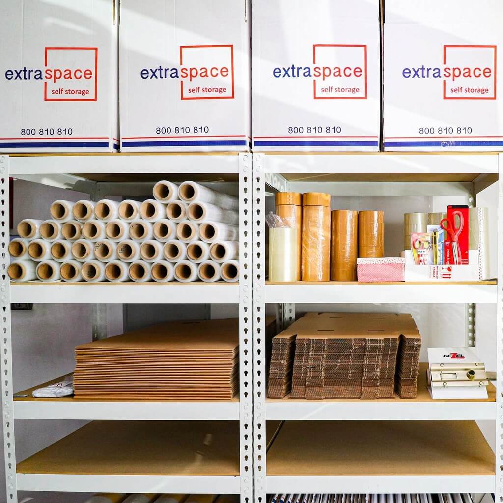 Organized industrial shelves with packing supplies for business use.