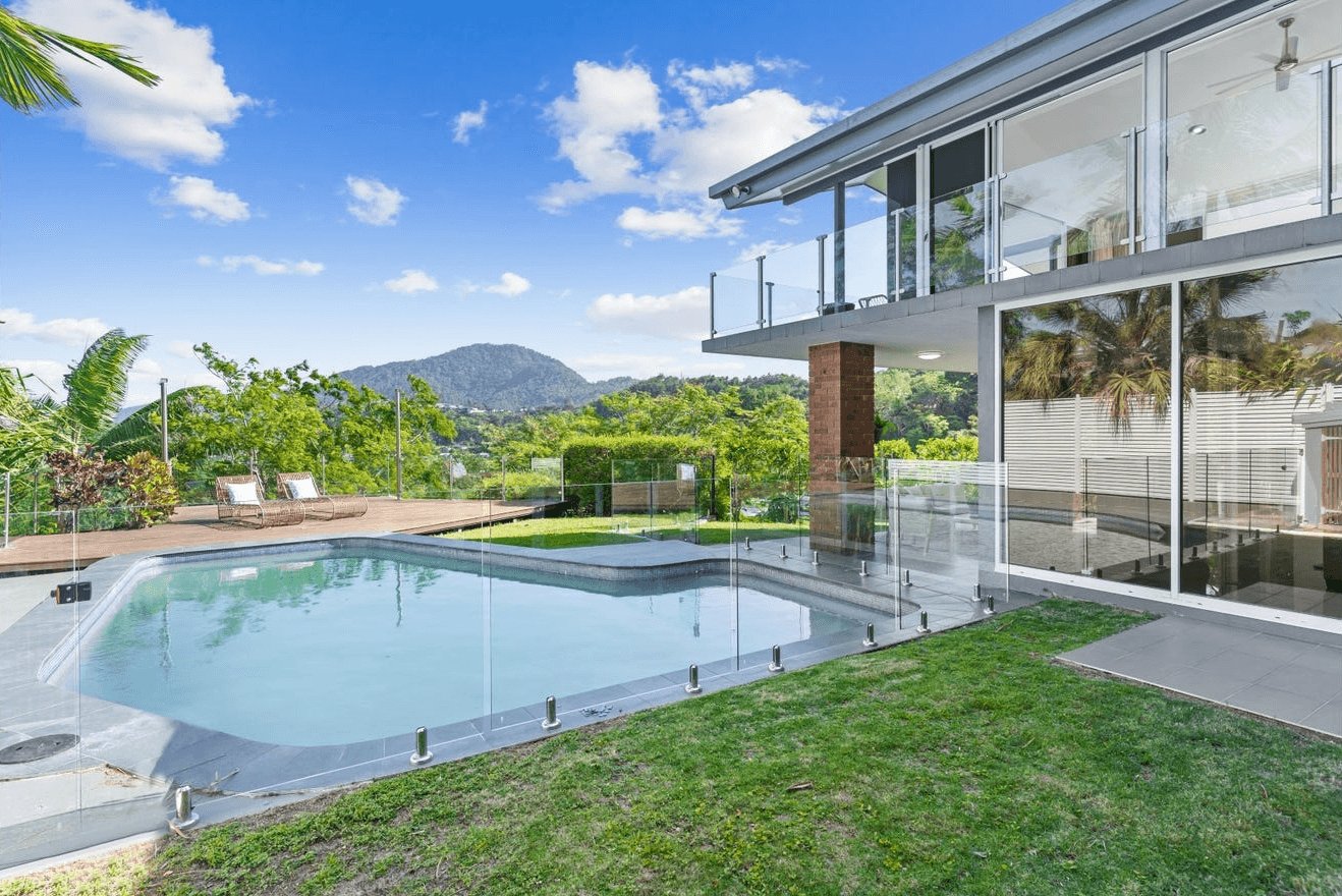 a living room filled with furniture and a large window