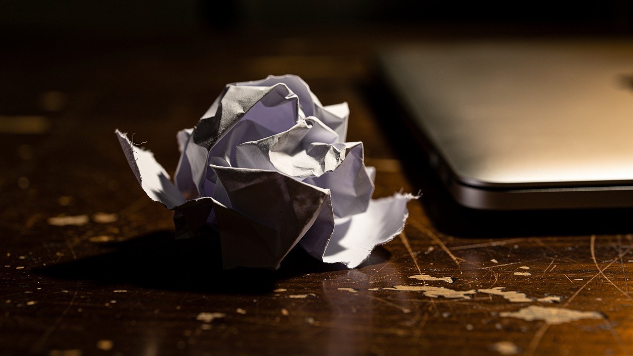 Discarded rigid phone script on desk