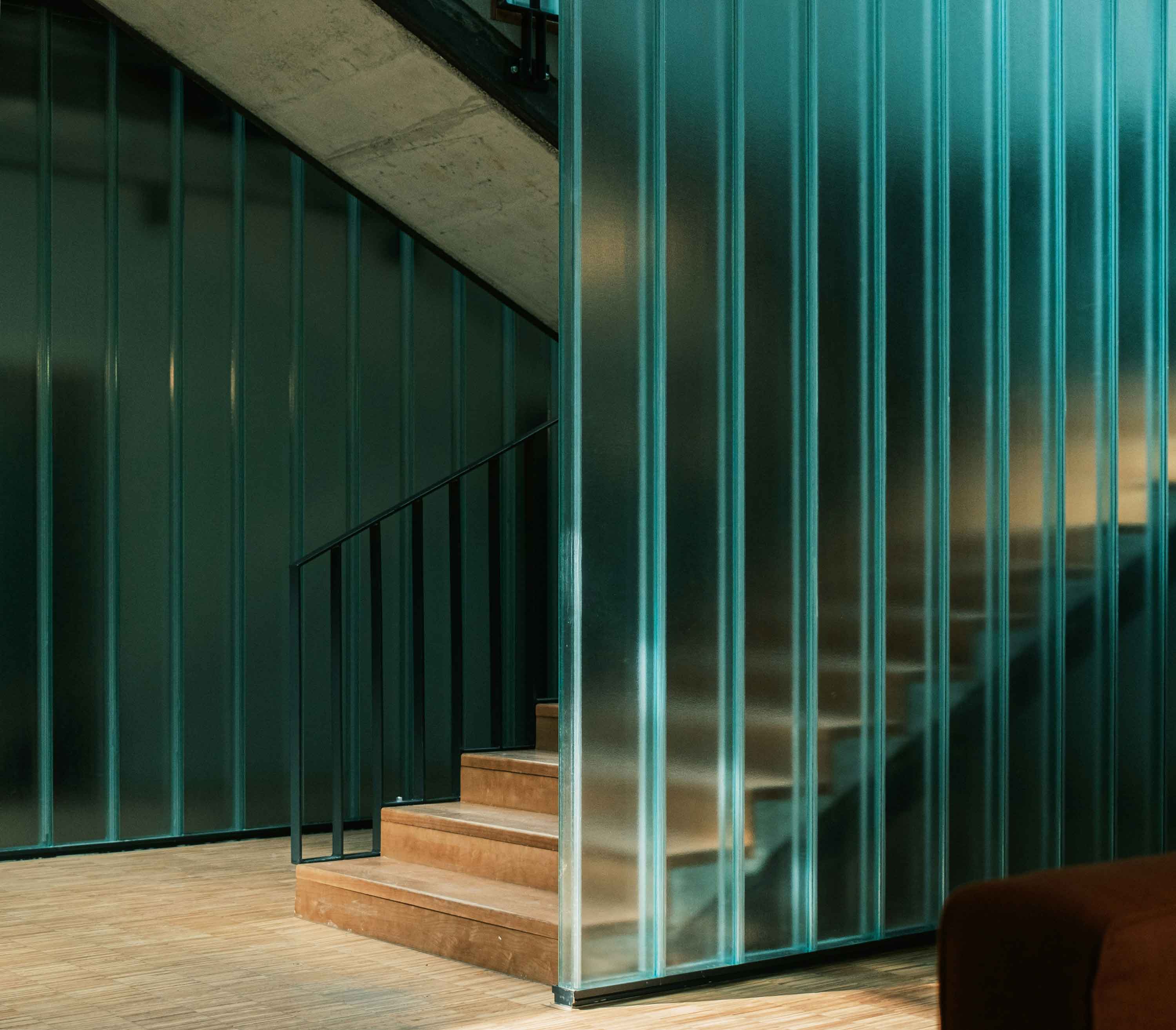 Glass-walled stairway showing stability and increased value