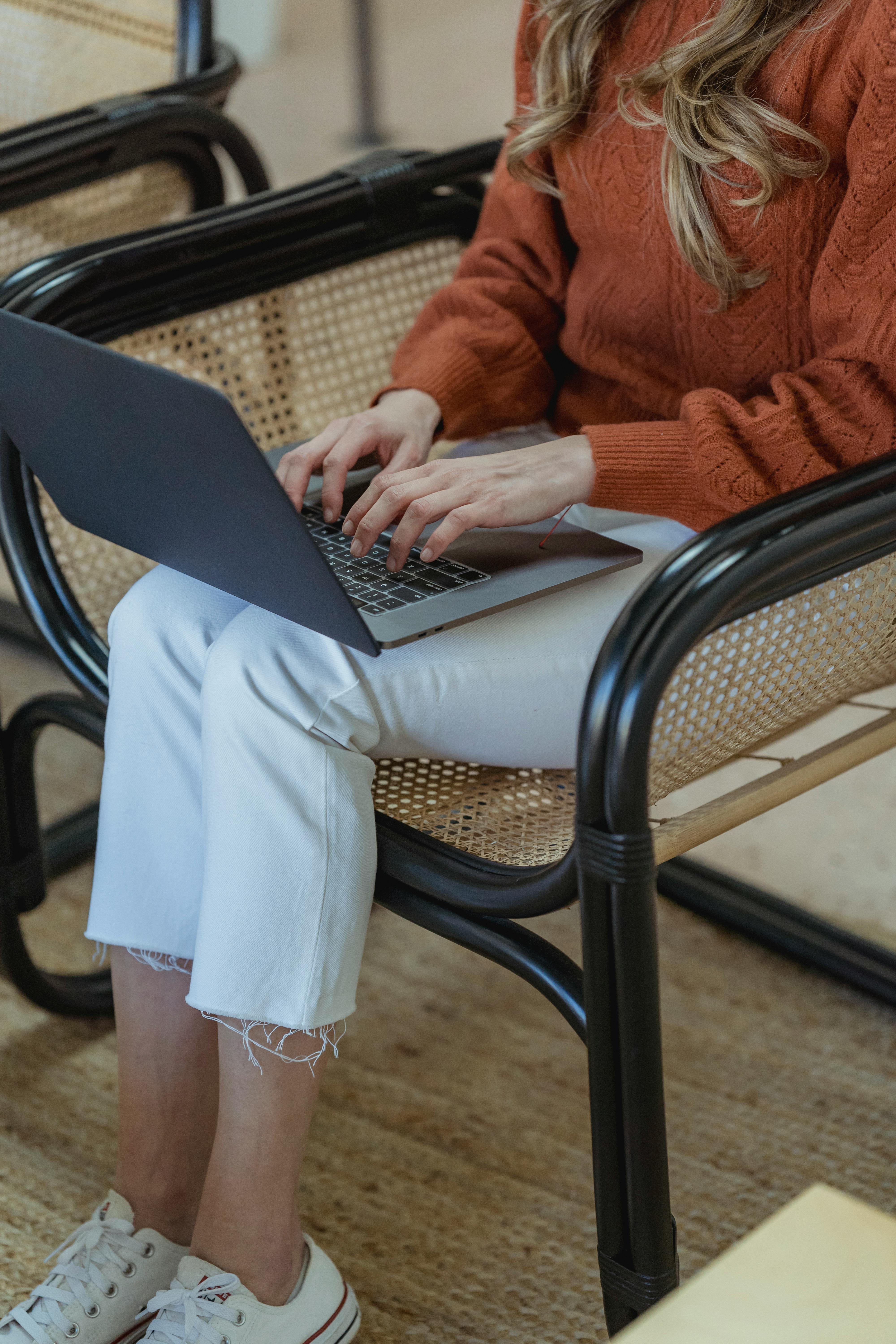 A picture of Woman working remotely on laptop, representing flexible dental billing staff