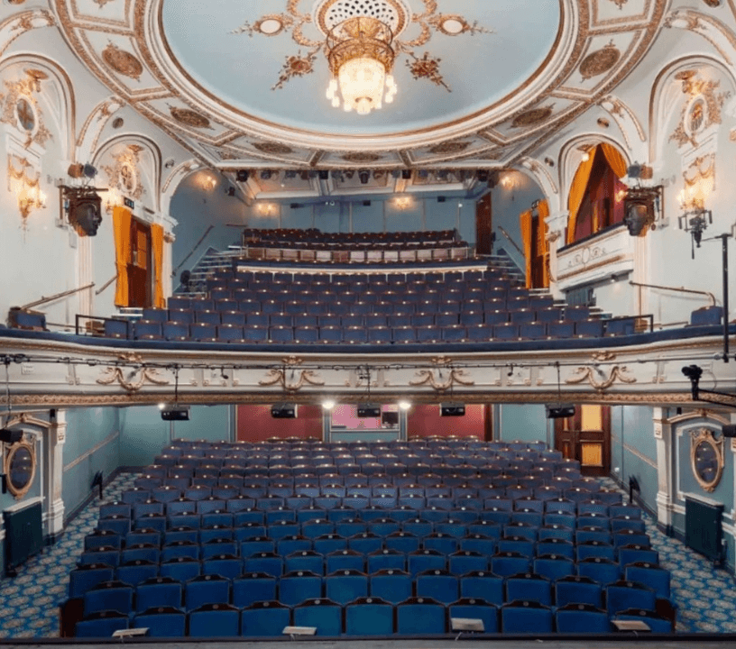 The auditorium of London's Ambassadors Theatre home of The Cusrious Case of Benjamin Button in the West End.