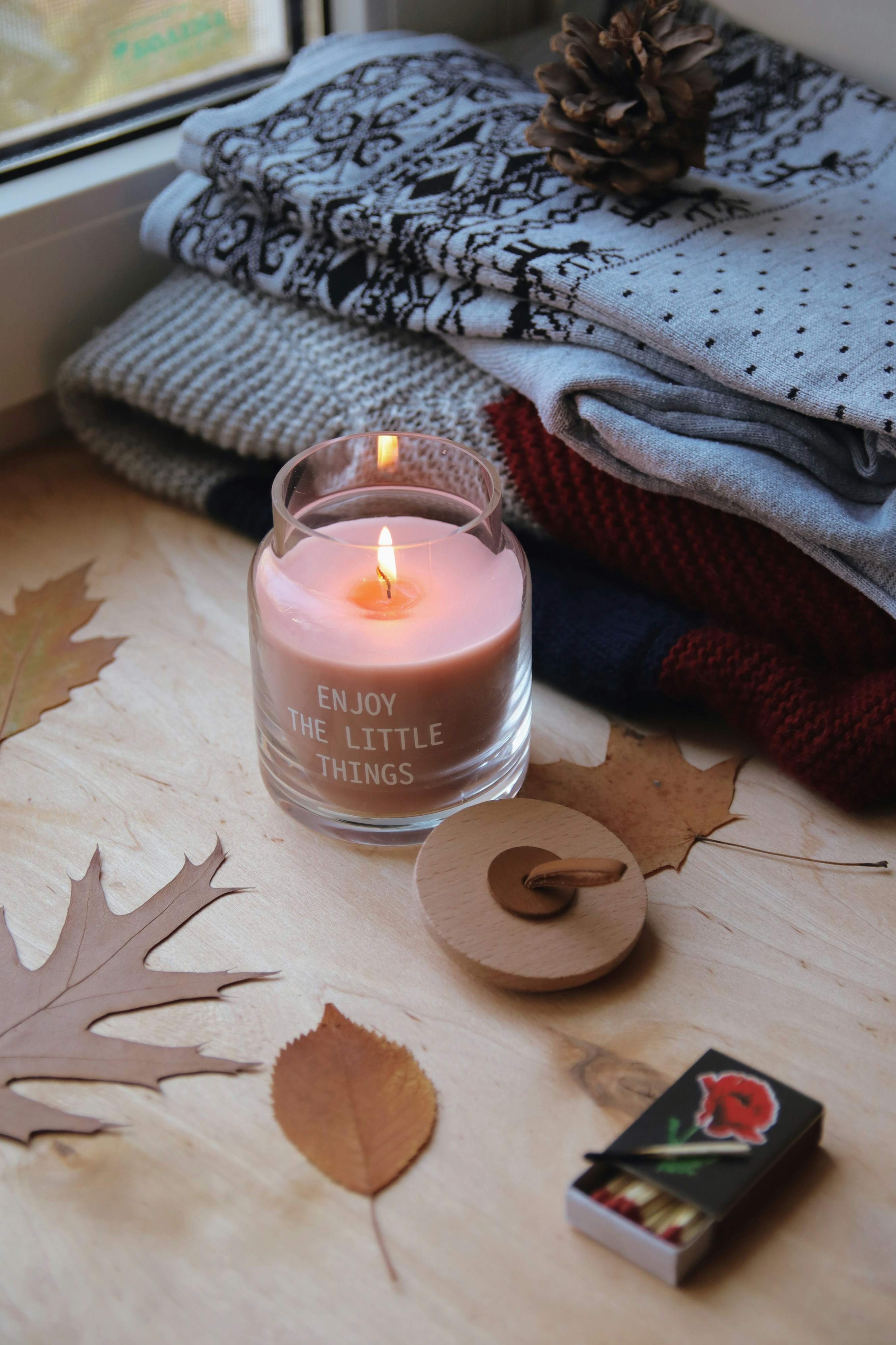 a candle sitting on top of a wooden table