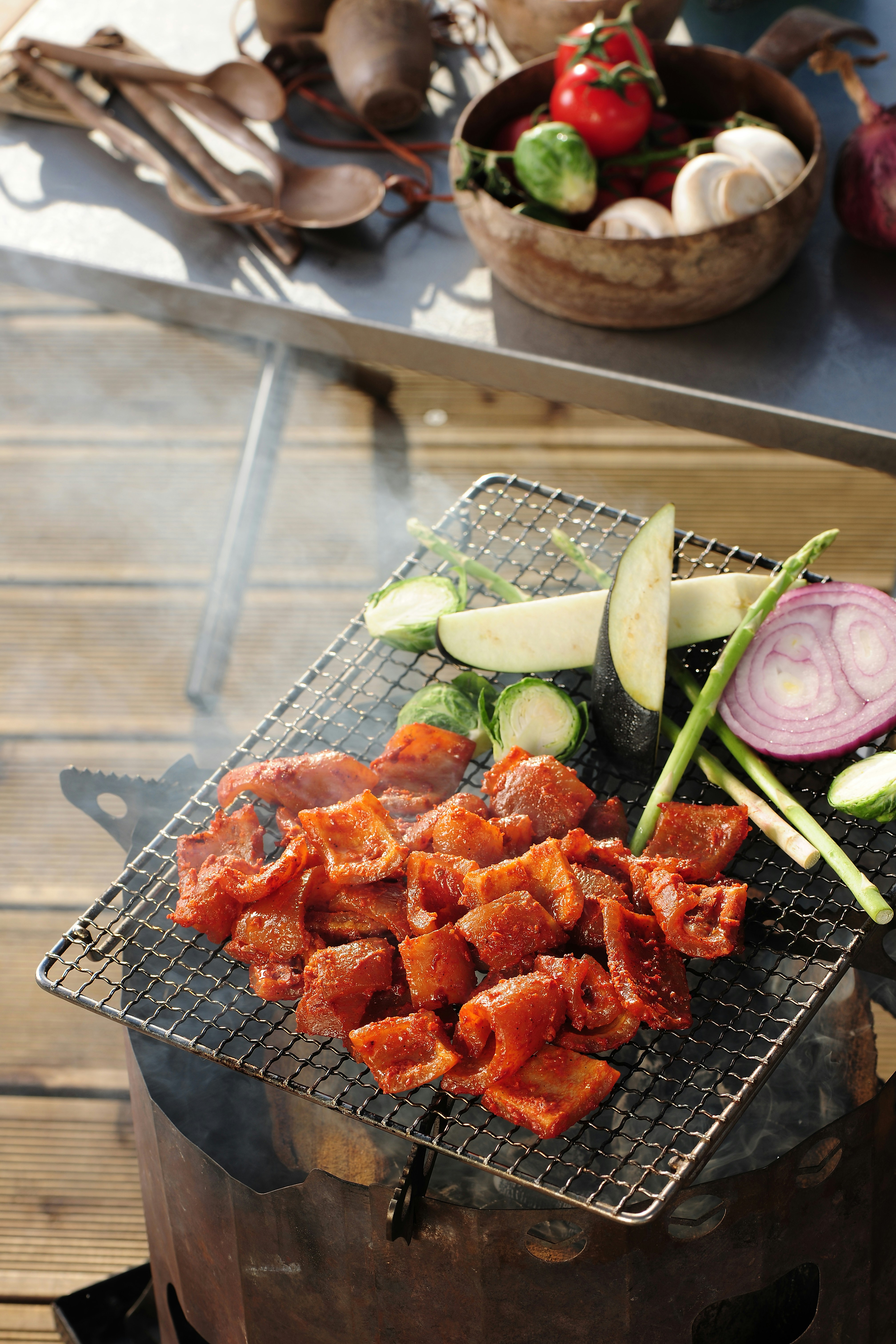 A woman with red hair in a lavender coat and scarf poses against a neutral background, showcasing a stylish and elegant look.