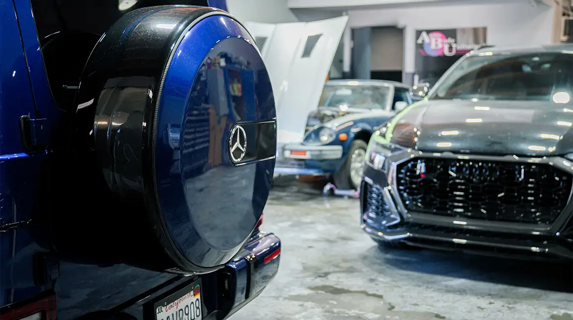 Mercedes-Benz vehicle inside Auto Body Unlimited’s shop during collision repair.
