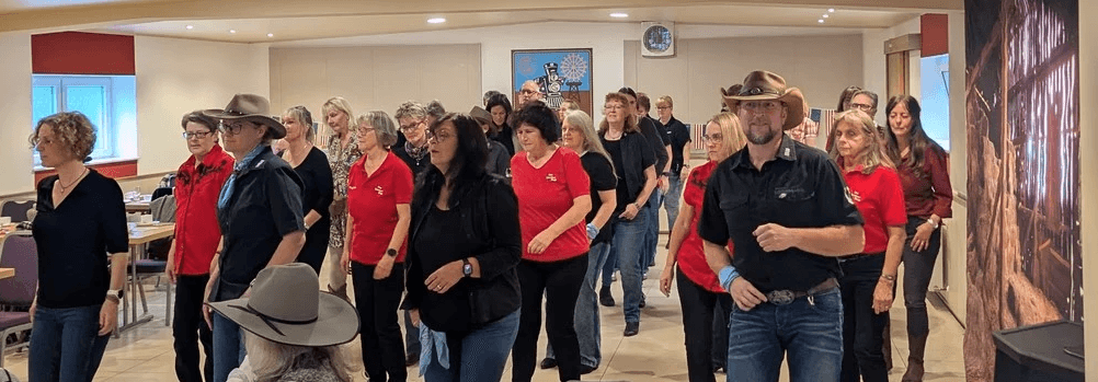 two young boys are playing tennis on a court