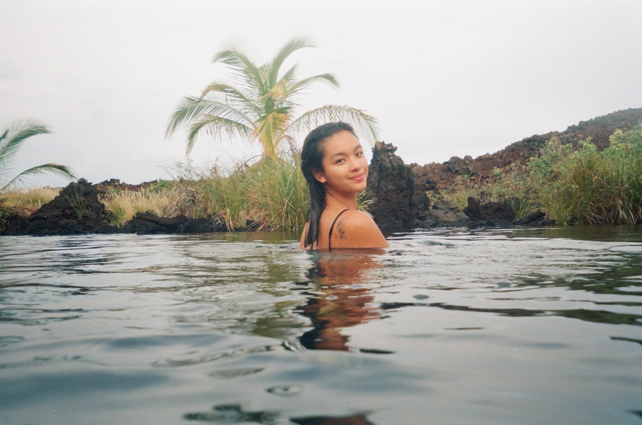 a blurry photo of a person standing in front of a wall