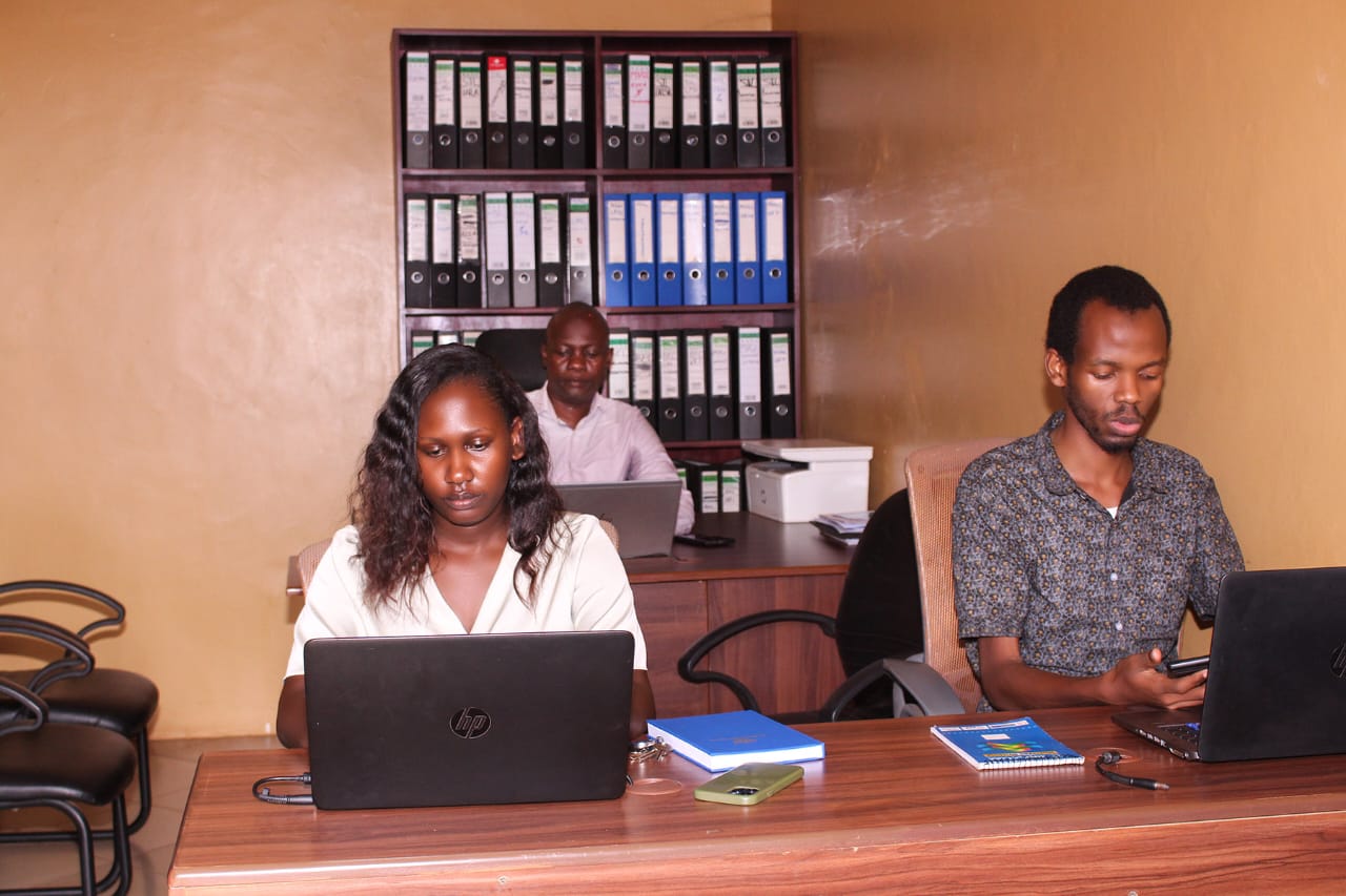 Moodplex Ventures Group Ltd employees on laptops, Kampala office