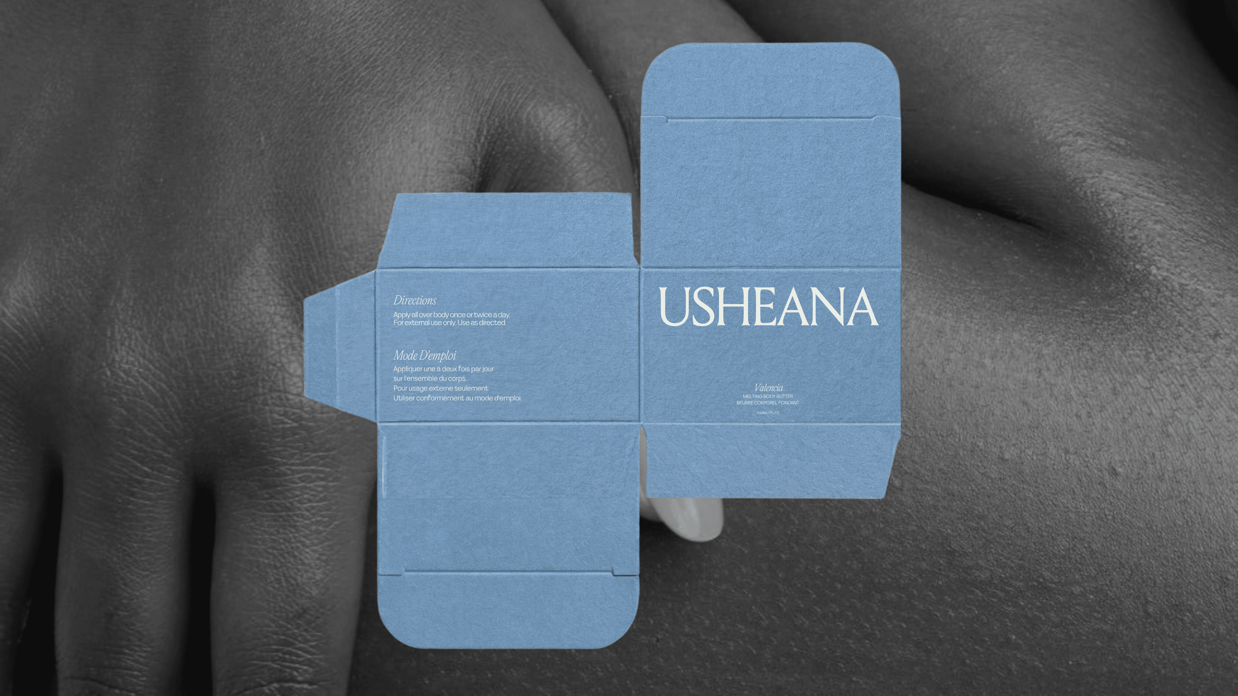 Luxury body care brand identity for Usheana featuring minimalist serif wordmark and sculptural “U” submark inspired by African beauty rituals, clean skincare packaging design and modern heritage branding