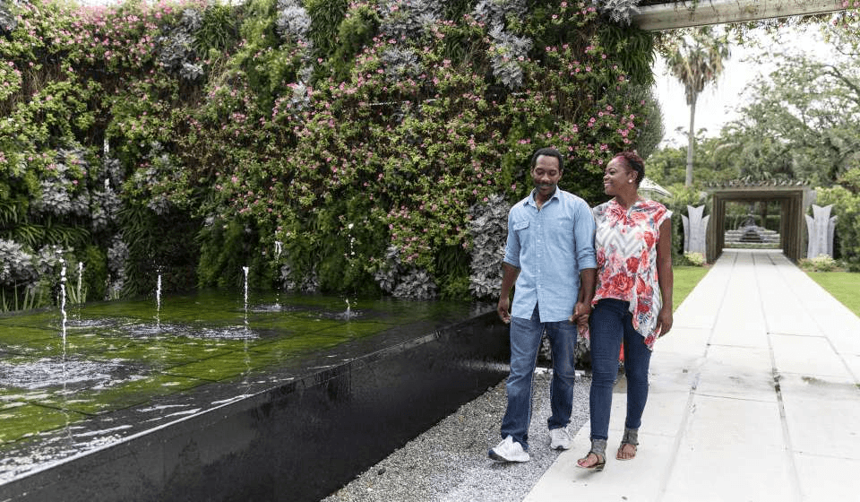 Couple walking through the Sculpture Garden in City Park in New Orleans