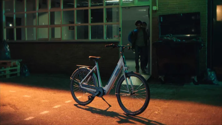 A Cortina bicycle standing outside