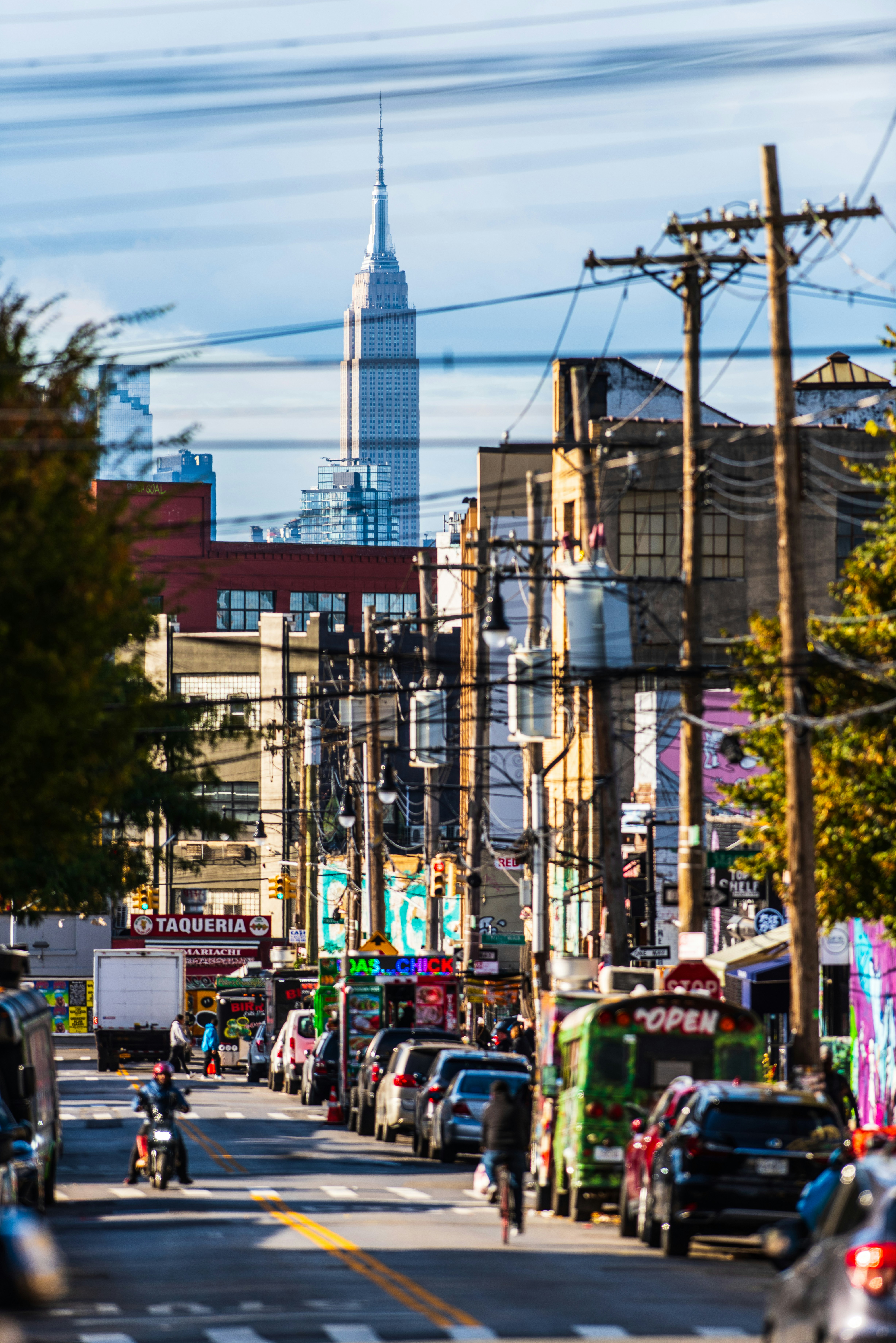 Empire state building visible over city street