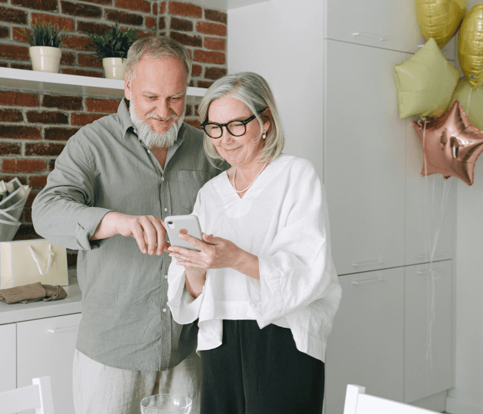 woman in brown coat using macbook air