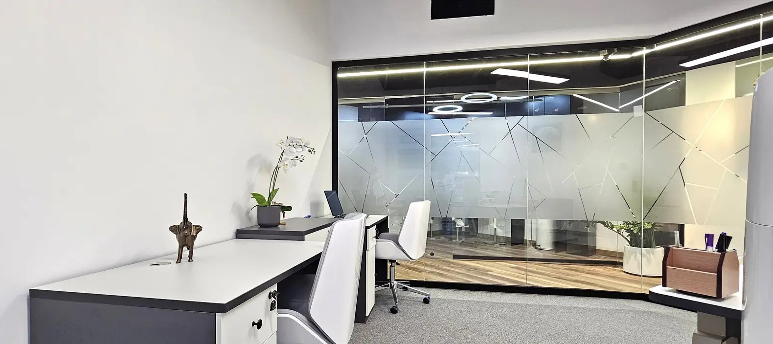 Private meeting room with frosted glass partitions, showcasing premium office design in Westburry Tower.