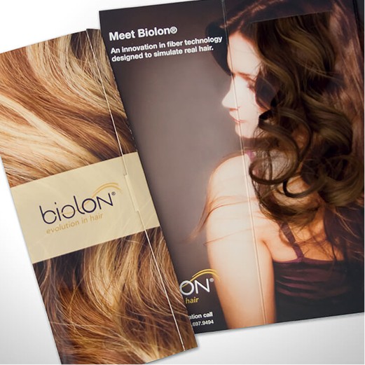 Close up of a brochure that says biolon and a woman looking to the side with wavy hair