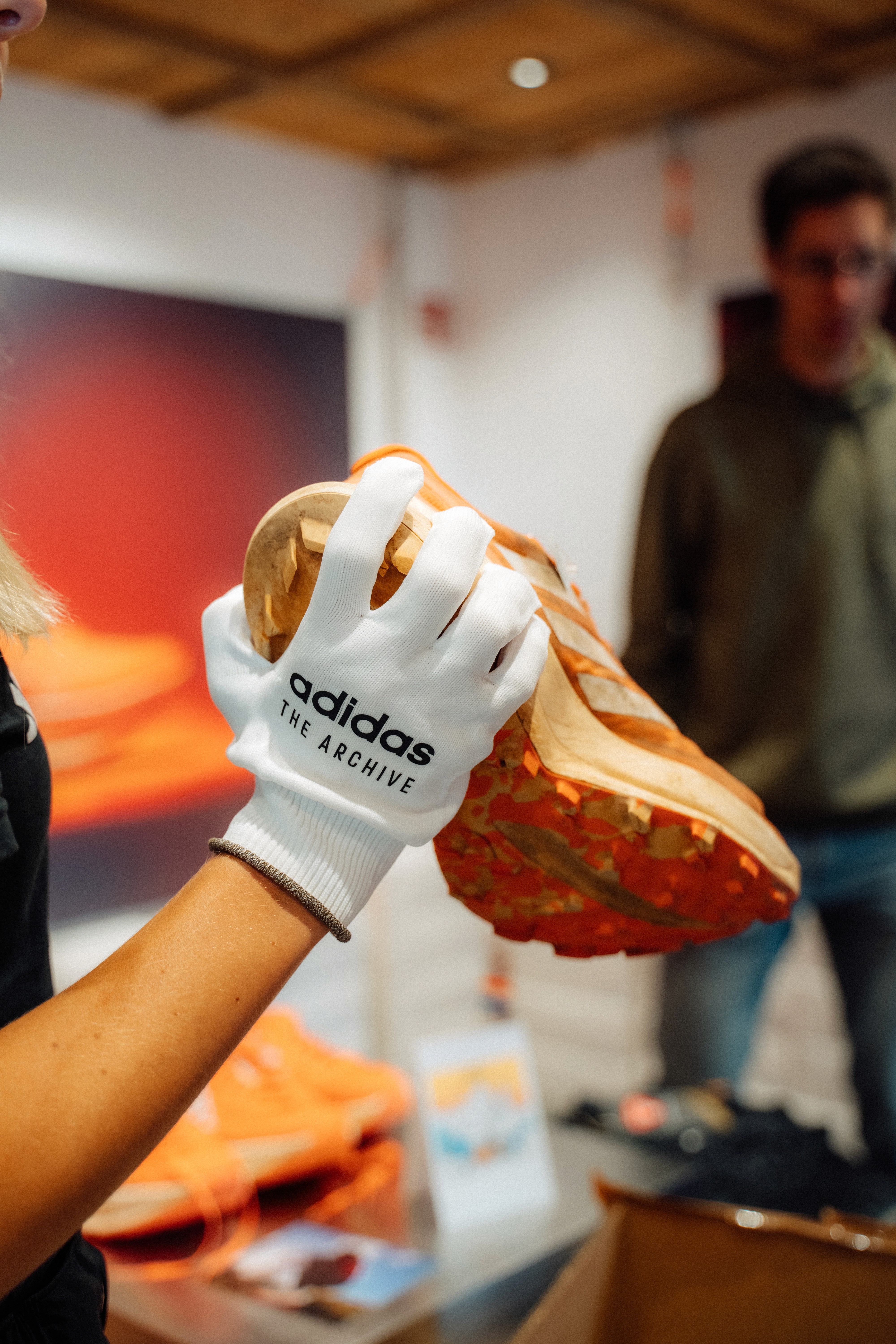 Hand holding a Adidas Terrex shoe from the archives - symbol of the brand's craftsmanship and heritage