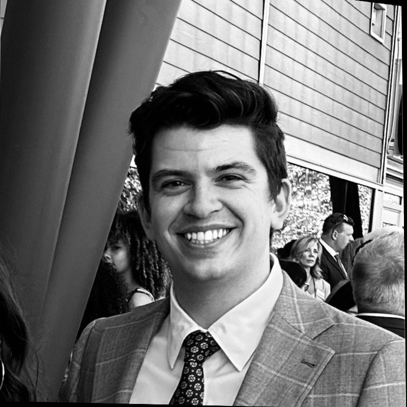 grayscale photography of man smiling