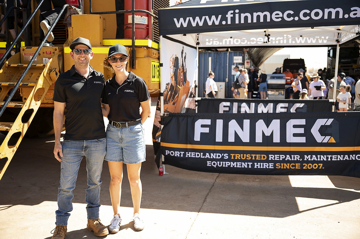 Cluster of translucent pink glass pendant spheres hanging on white—modern lighting décor.