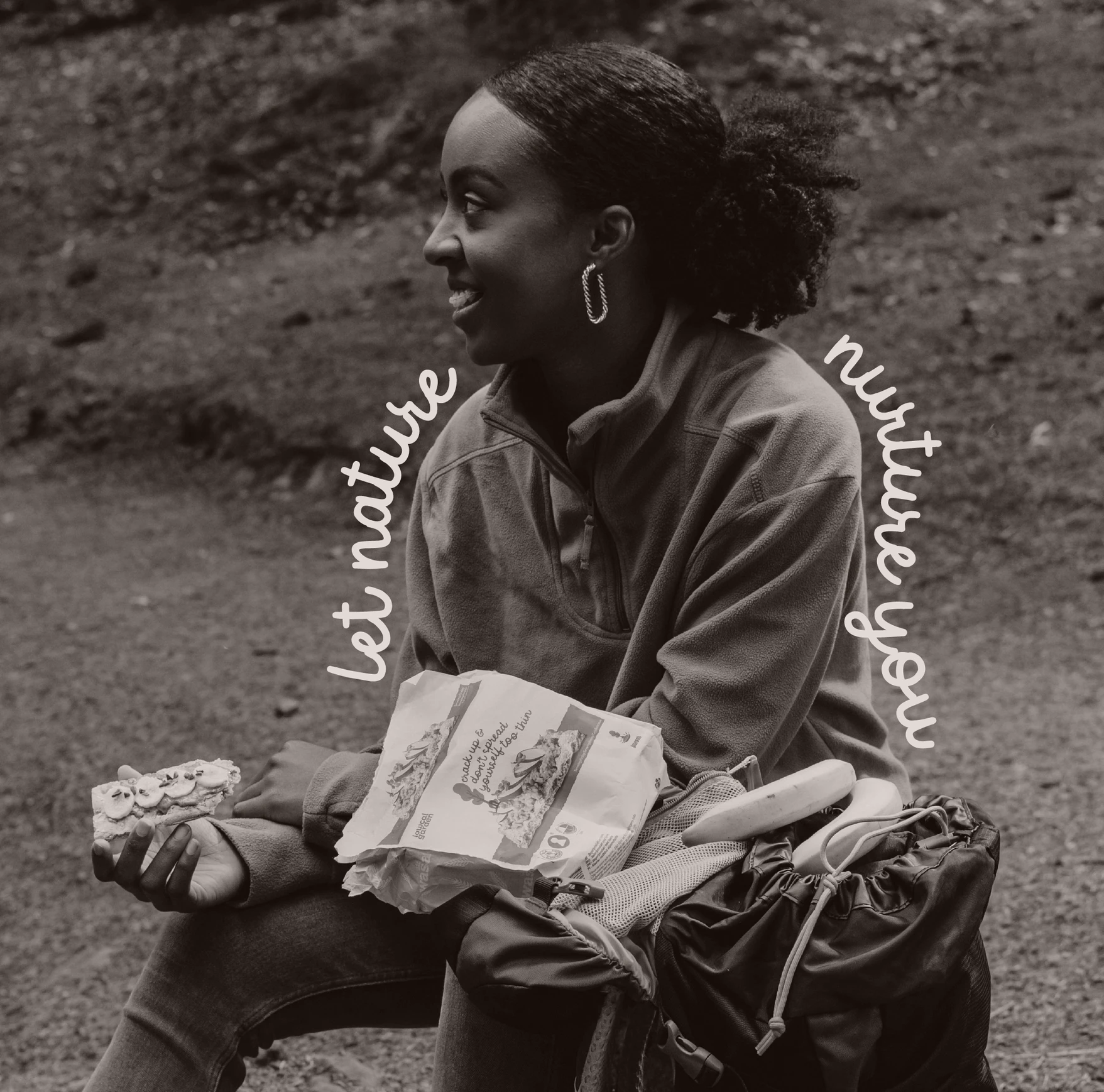 Lowcal Garden lifestyle campaign — 'Let Nature Nurture You' hand-lettered tagline over black and white photo of woman enjoying snack bar outdoors with backpack — brand photography and creative direction by Makers' Studio