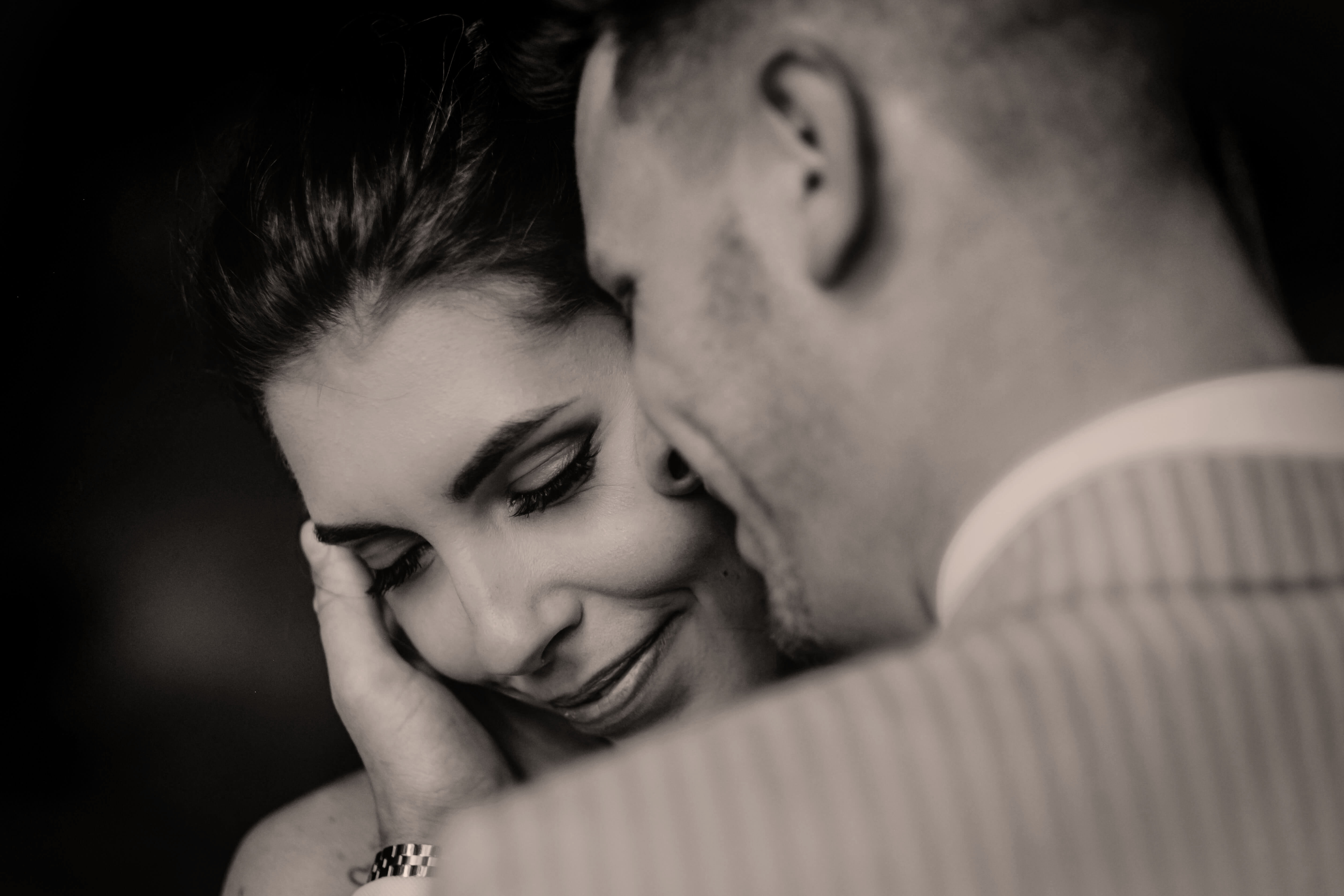 Couple lovingly holding each other