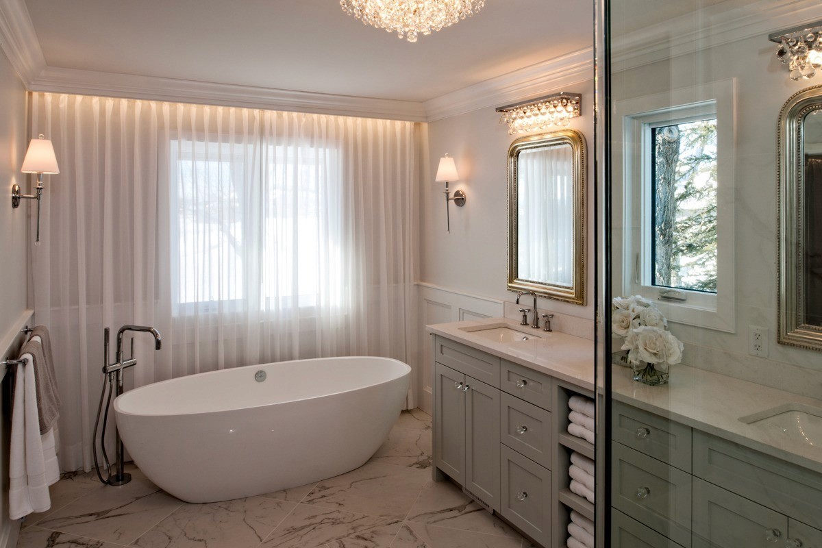 Image of Luxurious primary ensuite bathroom with freestanding tub, double vanity, and spa-like design by KHD Homes.